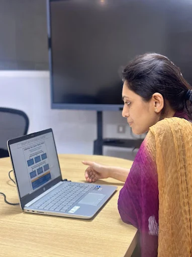 Dr. Madhuri reviewing a treatment plan in the clinical workspace